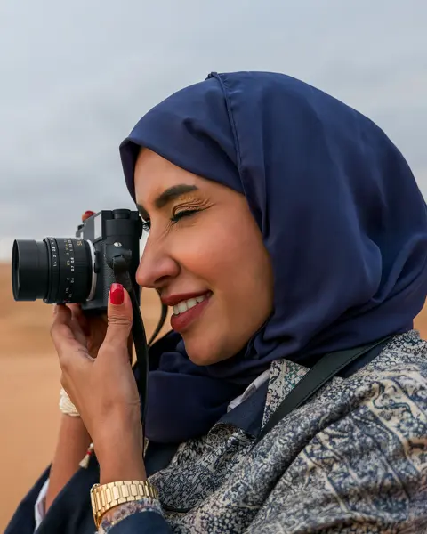 Woman with a Leica M11-Monochrom in the desert