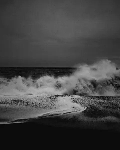 Black and white photo of turbulent waves