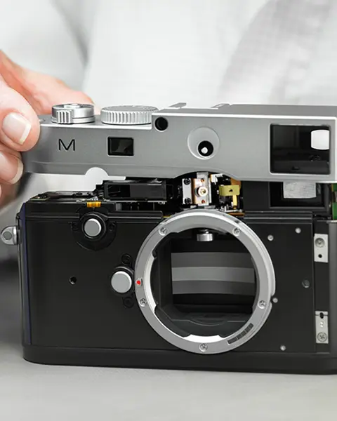 Man repairs a Leica M Camera