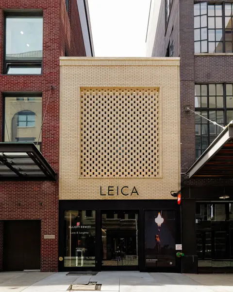 View of the entrance to a large building with the lettering ‘Leica’.