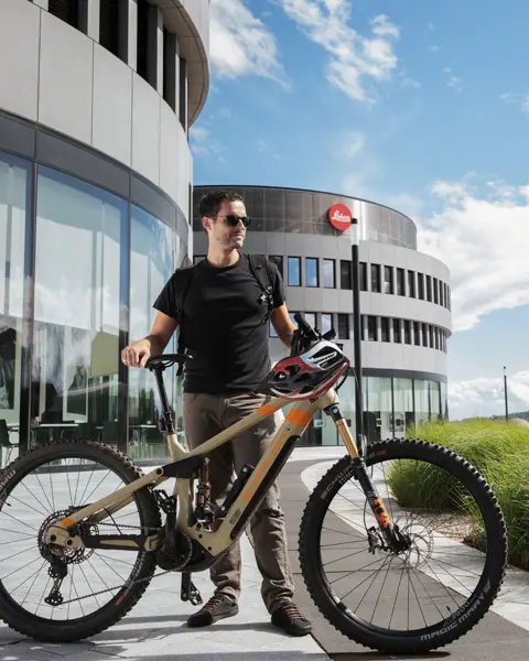 Leica Employee with his Jobbike