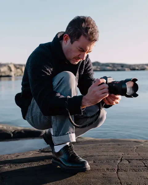 A person is taking photographs with the Leica SL3-S.