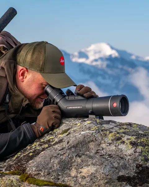Man-is-looking-through-his-Leica-Televid-HD-spotting-scope
