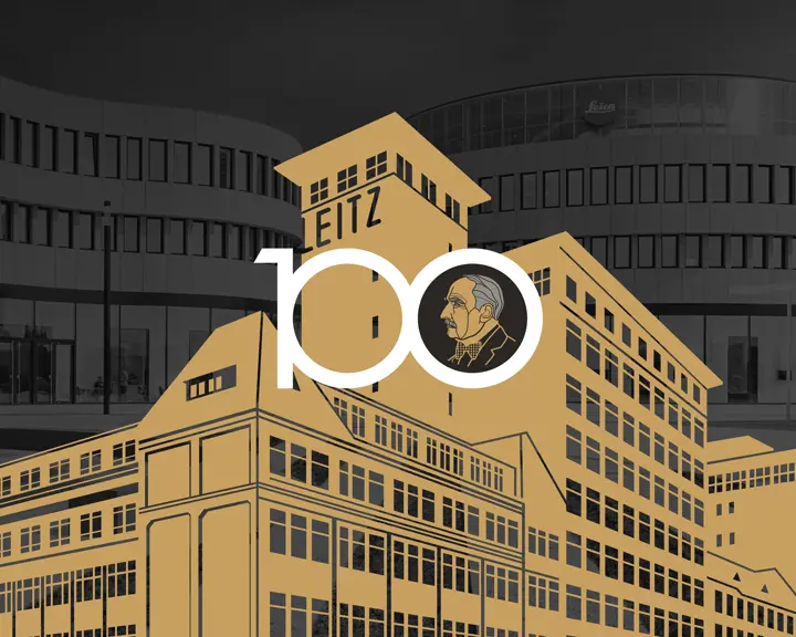 grafik Leitz factory in front of Leica office building. Lettering 100 in front