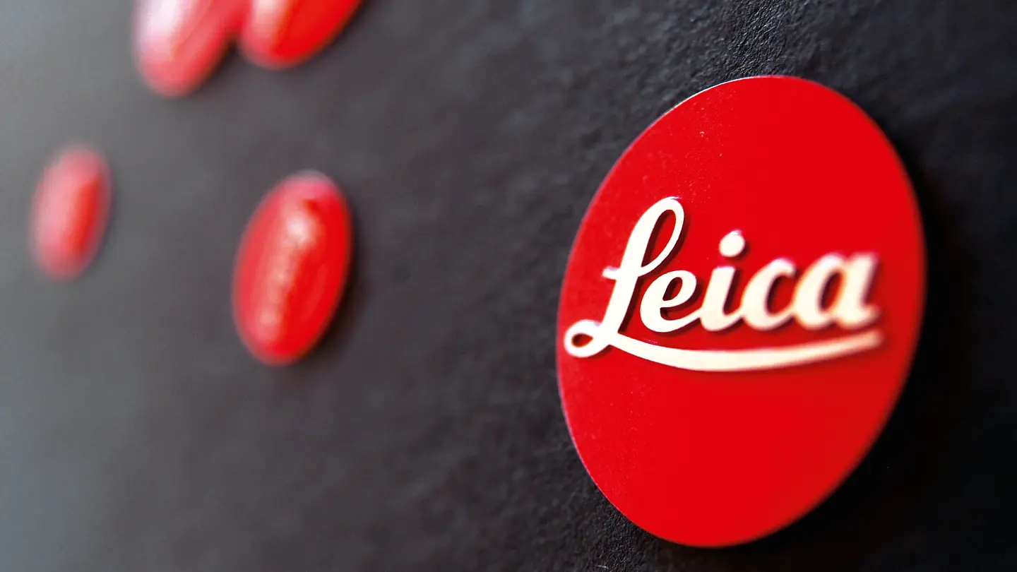 Close-up of the red Leica logo on a black background