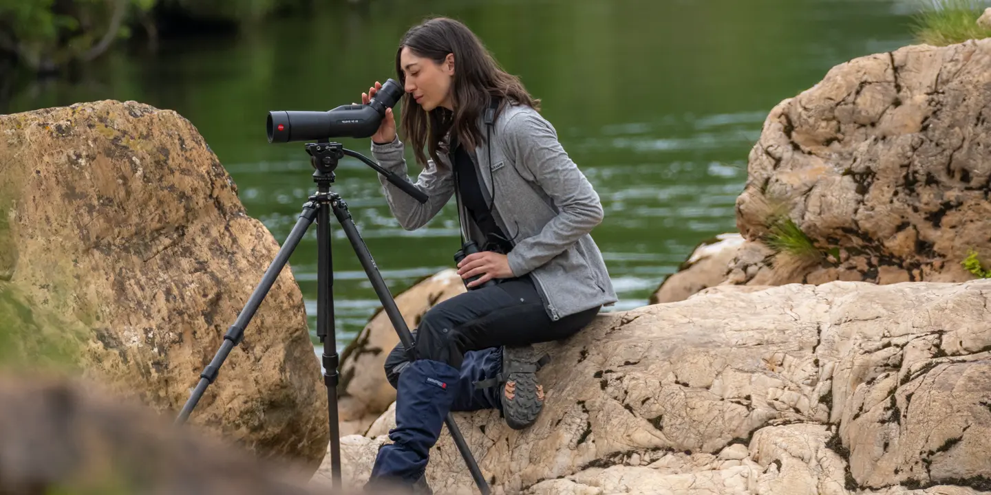 Woman-is-looking-through-her-Leica-Spotting-Scope