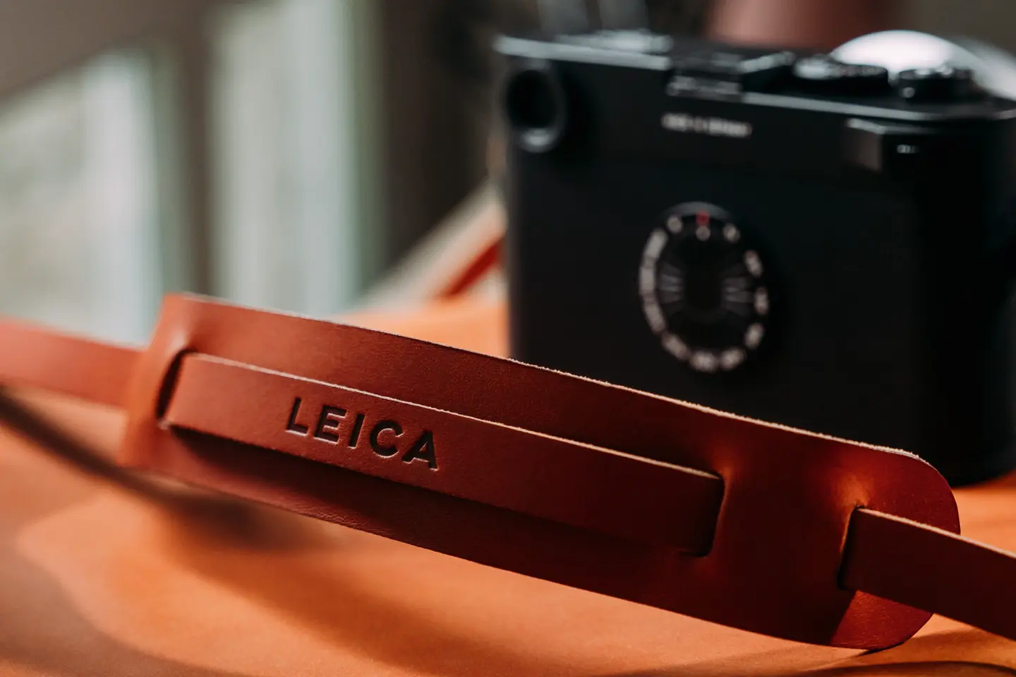 Leica camera with accessory strap