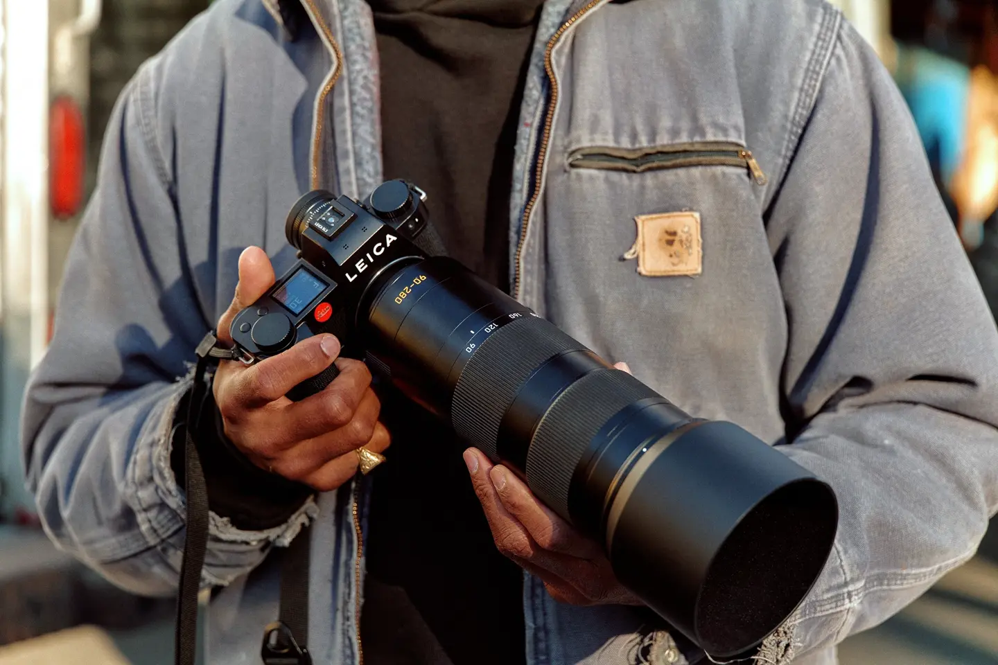 A man holding a Leica camera in his hand