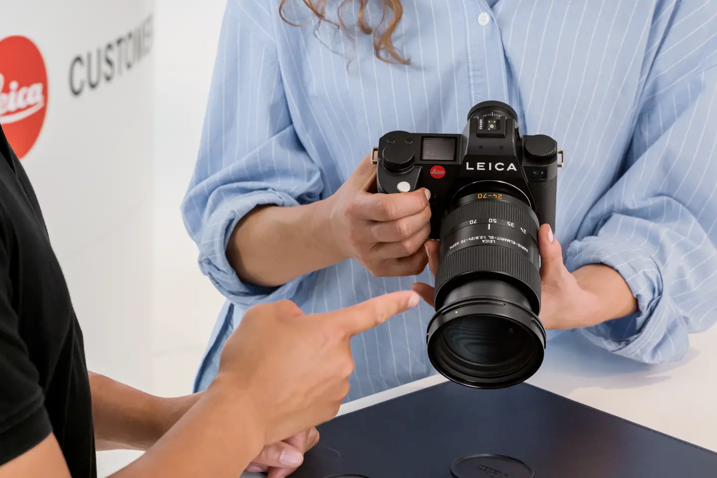 A woman with a SL3 in her hands