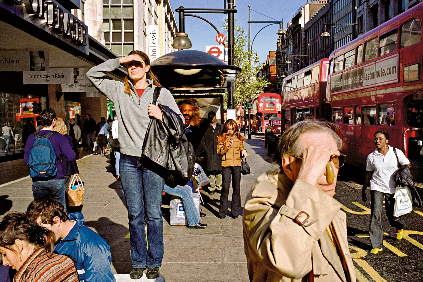 a woman who was standing on a bench, appearing to be looking for something