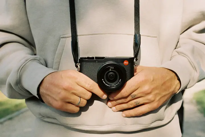 man with the leica lux 8