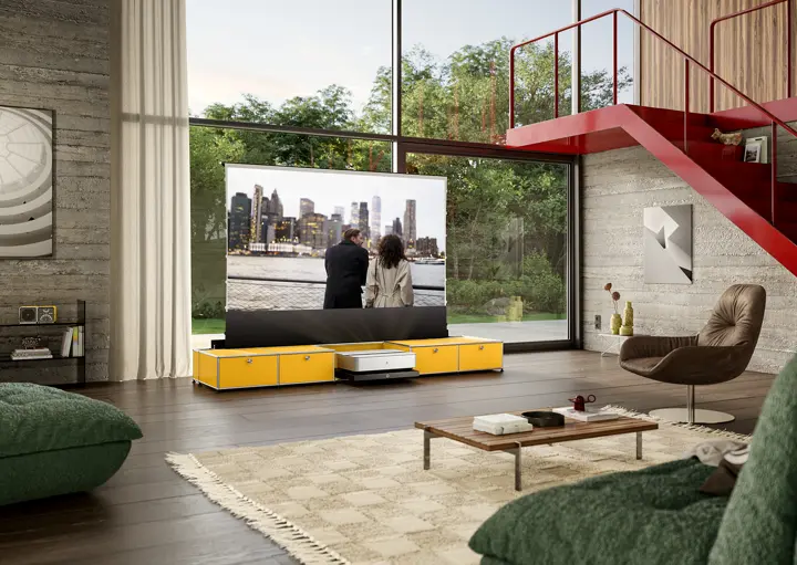 Leica Cine 1 on a USM TV lowboard showing people on the Leica Screen.