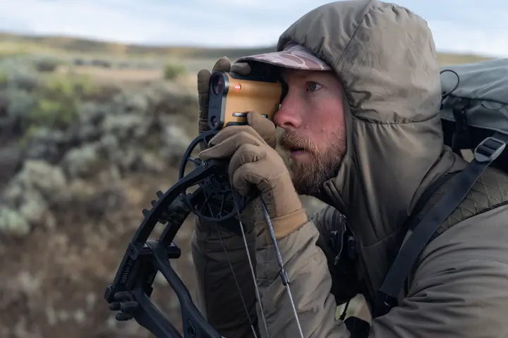 Man is looking through his Rangemaster CRF MAX
