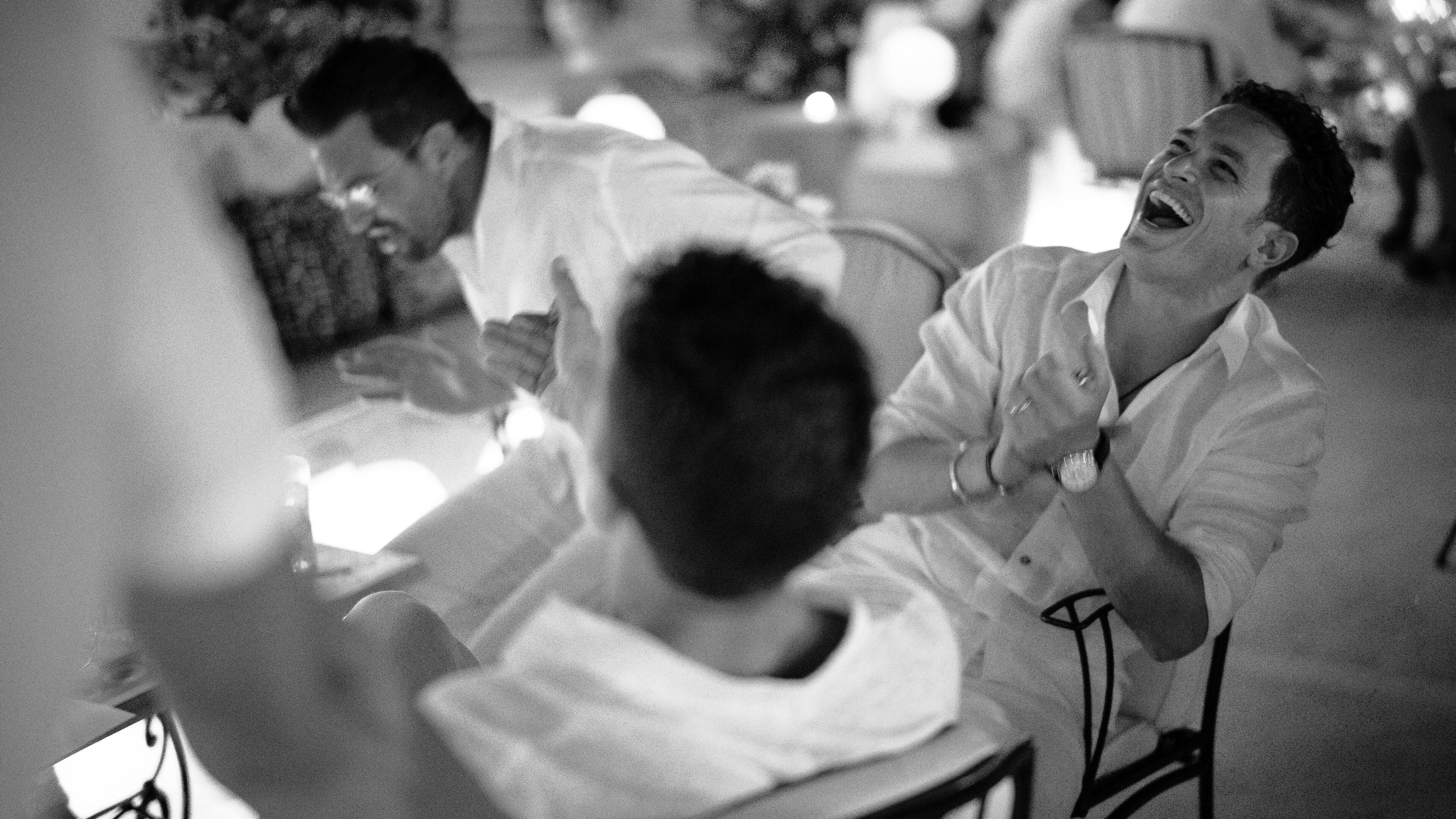 Laughing men at the table