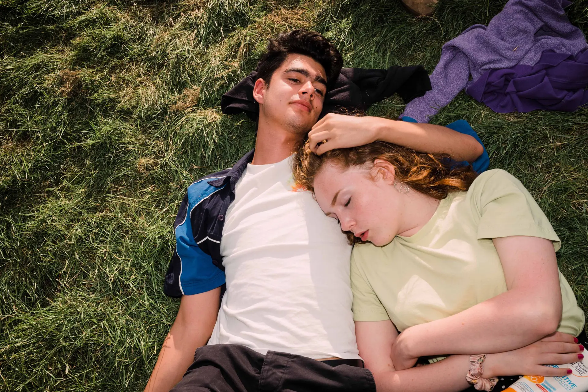 Couple lying in the grass